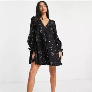 ASOS DESIGN Petite trapeze mini dress in star and moon embroidery in black